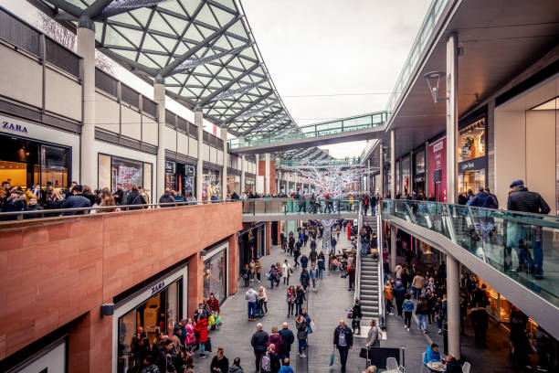 Christmas Shopping in Liverpool Only from iStock
Liverpool, UK - December 27, 2018: A busy pedestrianised outdoor shopping street in Liverpool's city centre, with people walking between shops on multiple levels. liverpool one stock pictures, royalty-free photos & images