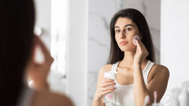 istock Girl Using Cotton Pad Removing Makeup Standing In Bathroom, Panorama 1182646118