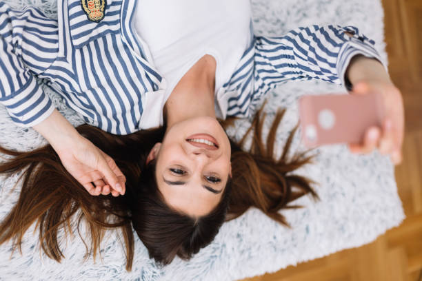 istock Beautiful woman taking selfie 1182646215