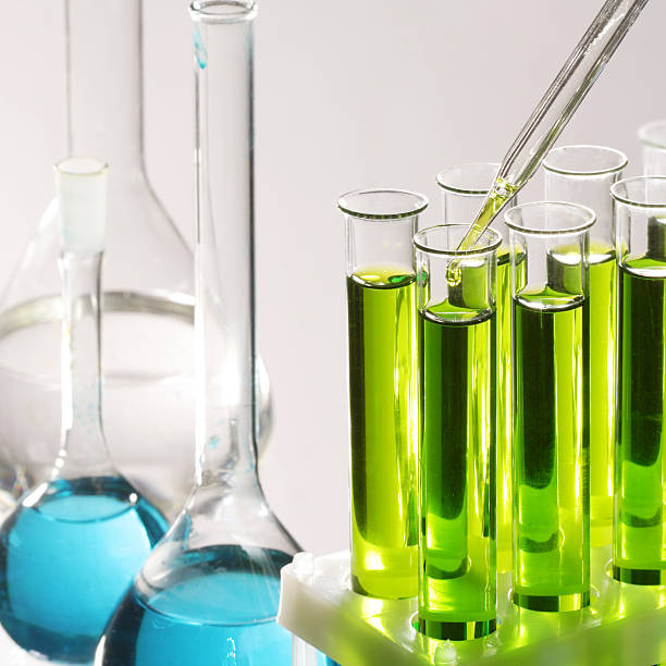 istock Clear test tubes with blue and green liquids inside 118264623