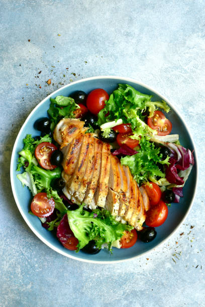 istock Grilled chicken breast with vegetable salad 1182646575