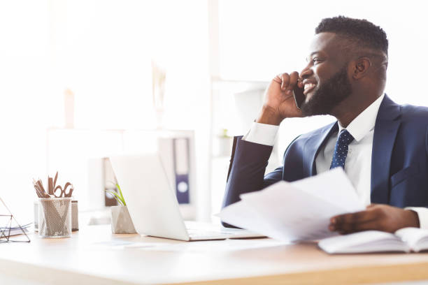 istock Successful entrepreneur talking with partners on smartphone 1182646813