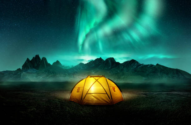 istock Camping Under Dancing Green Aurora Northern Lights 1182647739