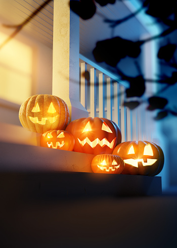 Halloween Pumpkin Jack O' Lanterns lighting up a decorated front porch. 3d Illustration.