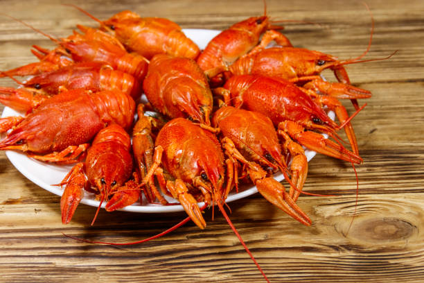 istock Boiled crayfish in plate on wooden table 1182648023