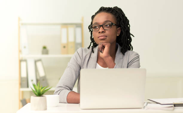 istock Thoughtful Entrepreneur Lady Sitting Touching Chin Thinking At Workplace 1182648054