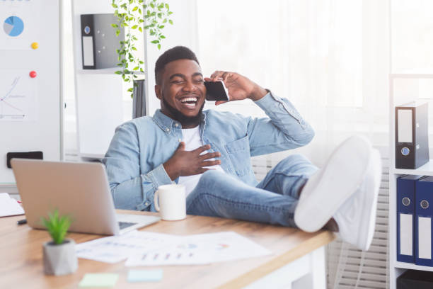 istock Laughing african american employee having break in work 1182648230