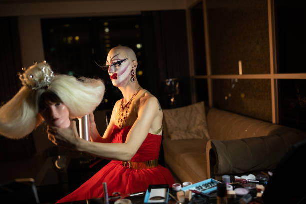 istock Drag queen looking at blond wig with crown 1182649682