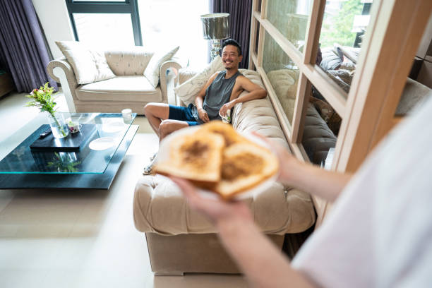 istock Unrecognizable men bringing breakfast to his partner 1182649747