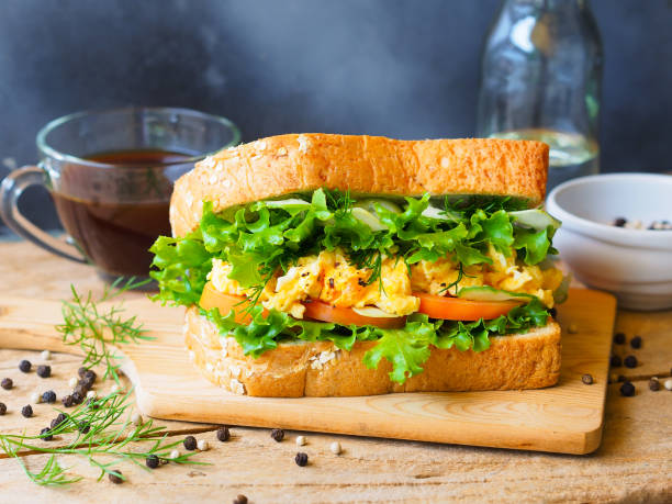 Scrambled eggs sandwich for healthy breakfast.