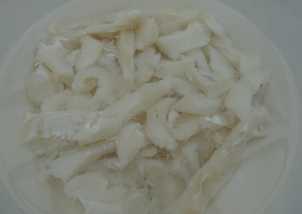 istock Dry cod being desalinated in cold water  Portion food 1182651901