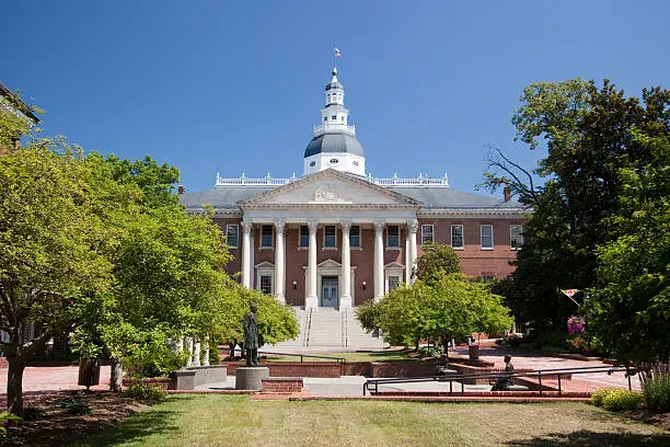 The Maryland State House is located in Annapolis and is the oldest state capitol in continuous legislative use, dating to 1772. It houses the Maryland General Assembly. The capitol has the distinction of being topped by the largest wooden dome built without nails in the nation. The current building, which was designated a National Historic Landmark in 1968 is the third statehouse to stand on the site.