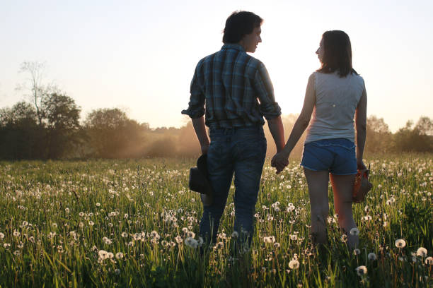 istock Cute couple on a walk by the countryside 1182653516