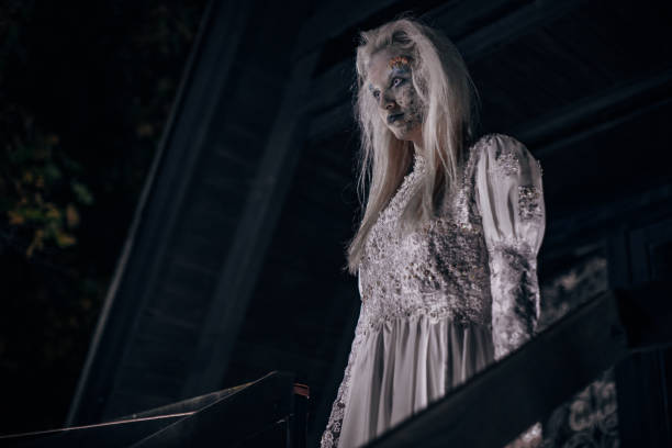 istock Scary halloween witch in white 1182655330