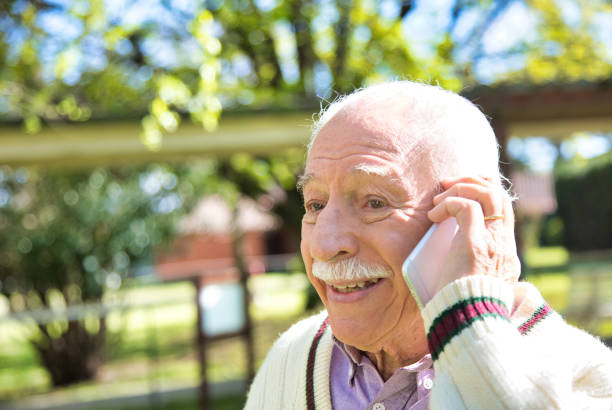 People with modern technology.  Elderly man with smartphone. Retirement Community