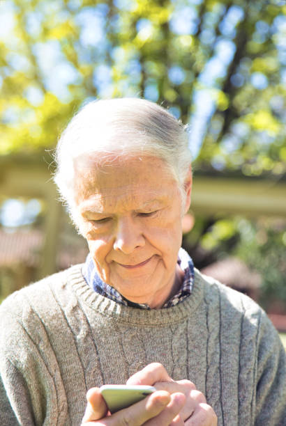 istock People with modern technology.  Elderly man with smartphone browsing on social network 1182655654