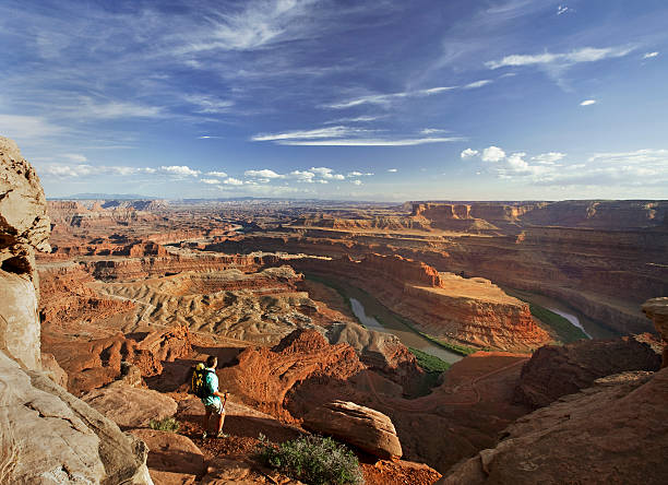 istock Hiker Standing On Rocks Looking At View In Moab, Utah 118265610