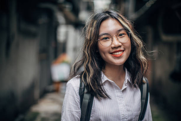 istock Charming young lady standing in alley downtown 1182657519