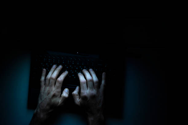 istock hands of a programmer on  his laptop 1182657698