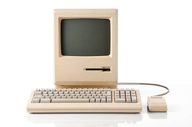Apple Macintosh Classic Computer Old retro classic computer. The image has a clipping path on both screen and main computer. obsolete stock pictures, royalty-free photos & images