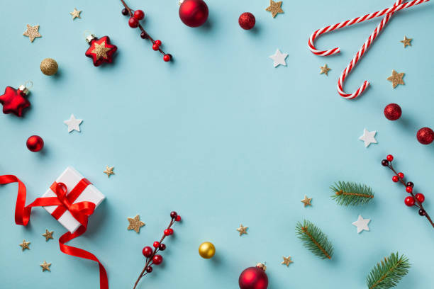 istock Gift or present box and holiday decorations on blue background top view. Christmas frame. Flat lay. 1182659226