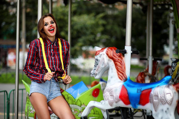 istock Cute girl in a clown makeup 1182661236