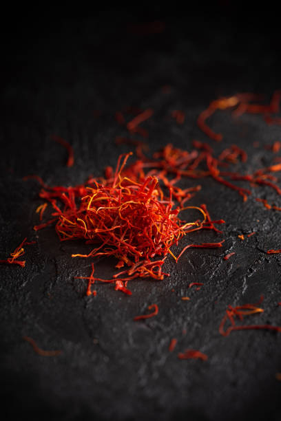 Dry saffron Dry saffron petals spices heap on table saffron stock pictures, royalty-free photos & images