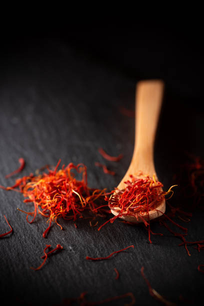 istock Dried saffron spice in wooden spoon 1182661970