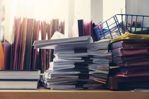 istock Close-Up Of Papers On Table 1182662164
