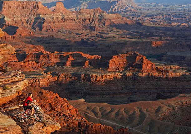 istock High-Angle View Of Mountain Biker Overlooking Canyons In Utah 118266442