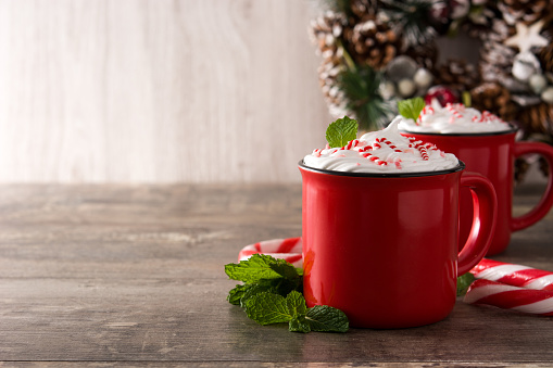 Peppermint coffee mocha for Christmas on wooden background