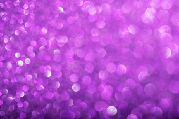 istock Shiny purple defocused glitter background. 1182669462