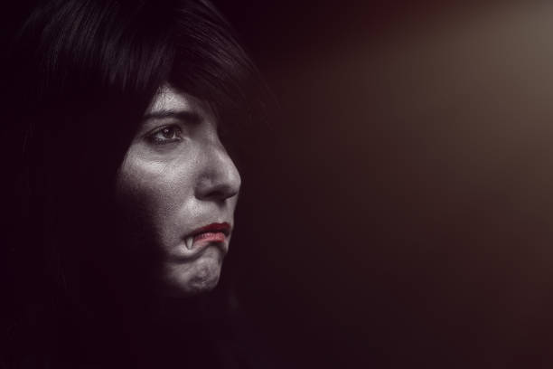 istock Halloween Vampire Beautiful Woman over black 1182672061