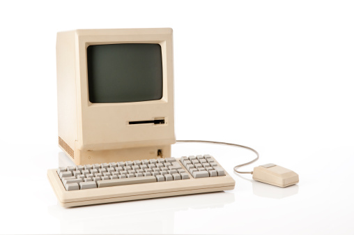 Old retro classic computer, keyboard and mouse. The image has a clipping path on both screen and main computer.