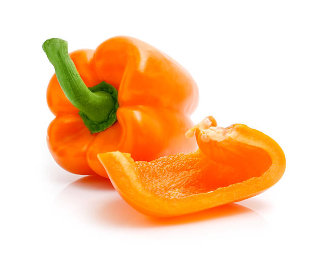 istock fresh orange peppers with cut isolated on white 118267524