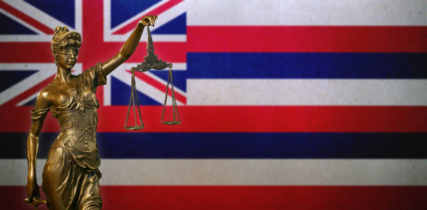 istock Lady Justice before a flag of Hawaii 1182675692