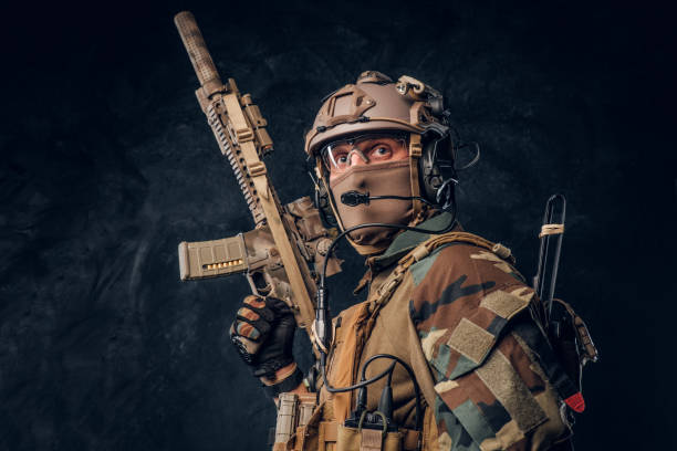 istock Elite unit, special forces soldier in camouflage uniform posing with assault rifle. 1182676105