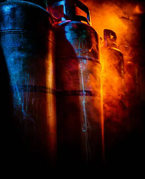 Photo of close up of gas bottles in smoke