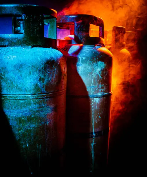 Photo of close up of gas bottles in smoke