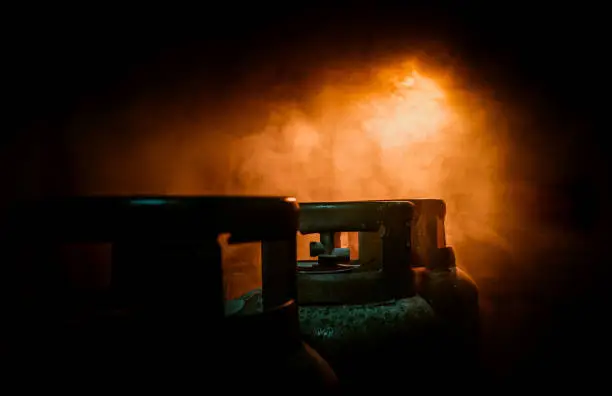 Photo of close up of gas bottles in smoke