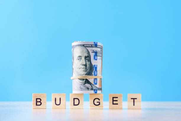 istock Money Against Blue Background 1182676877
