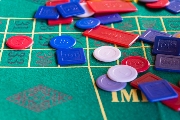 istock roulette green table with numbers and poker casino chips 1182680294