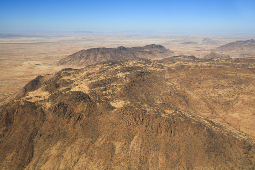 Aerial view from a helicopter of the Jebel Marrah Mountains in Darfur, Sudan. The Marrah are a range of volcanic peaks in a massif that rises up to 3,042 metres, they are the highest mountains in Sudan.