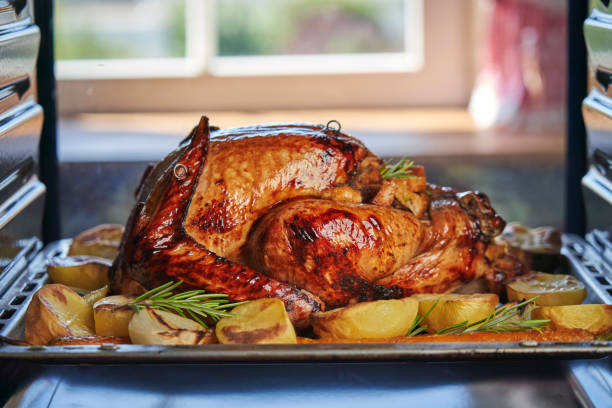 istock Roasting Turkey in the Oven for Holiday Dinner 1182683193