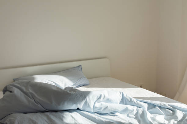 istock Bed after sleeping in the morning in the sun 1182683295