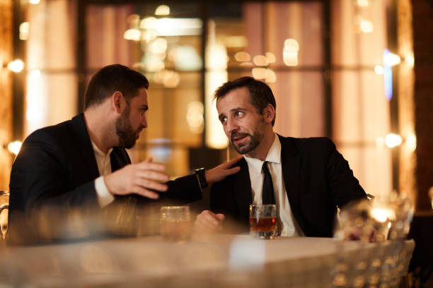 istock Two Business People Drinking in Restaurant 1182684672