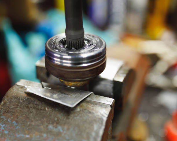 istock ATV constant-velocity CV joint repair in old garage 1182685597