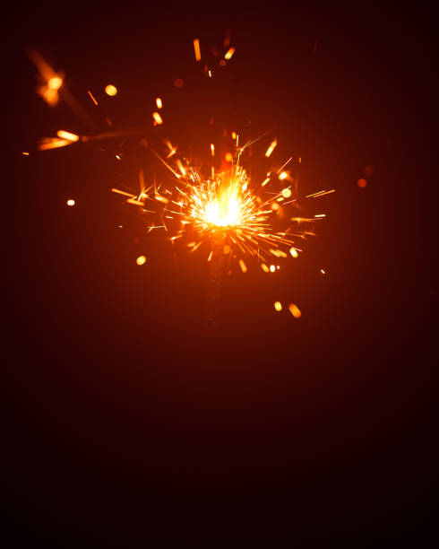 istock Christmas sparkler in haze with red light 1182685658