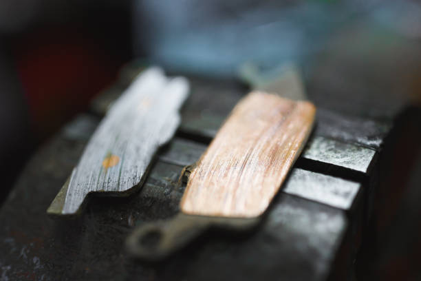 istock bad brake pads on vice tool 1182686276