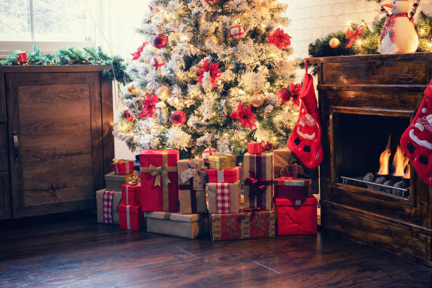 istock Decorated Christmas Tree Near Fireplace at Home 1182686788
